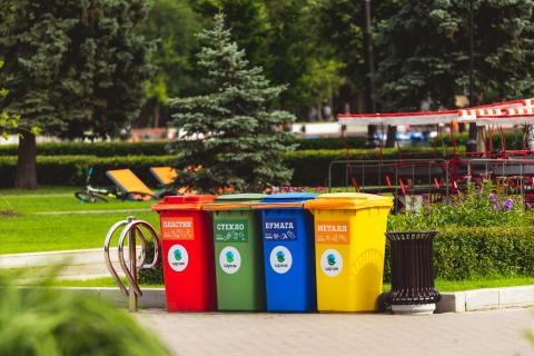Garbage, compost, and recycling bin in a park